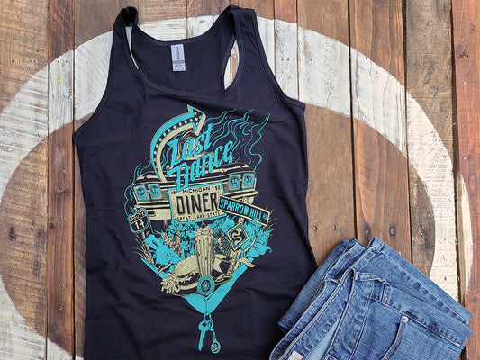 An illustrated typography graphic tank top that reads "Last Dance Diner" and features iconography from the book Sparrow Hill Road by Seanan McGuire. The tank top is black with teal and gold ink. The illustration includes a license plate, roses, a burger and milkshake diner meal, and road sign.
