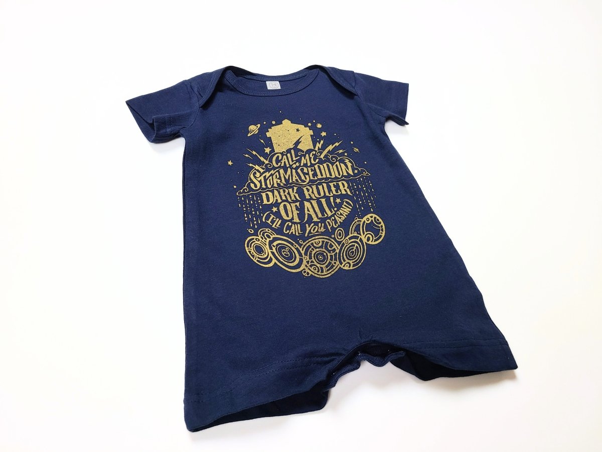 Navy blue baby romper with gold text and design on a white background