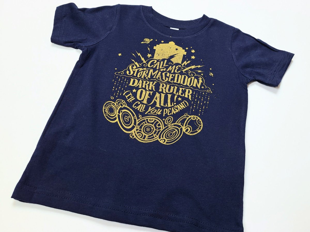 Navy blue toddler shirt with gold graphic design on a white background