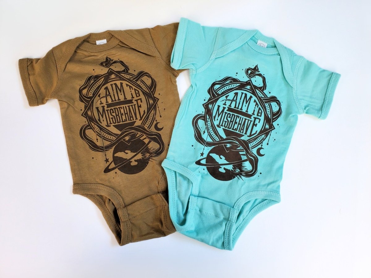 Two baby onesies, one brown and one turquoise, with a graphic design and text on a white background.
