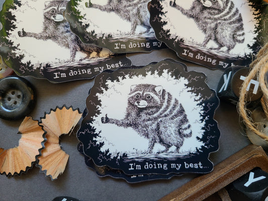 A set of die-cut stickers featuring a black and white sketch of Jimothy the raccoon with the text 'I'm doing my best.