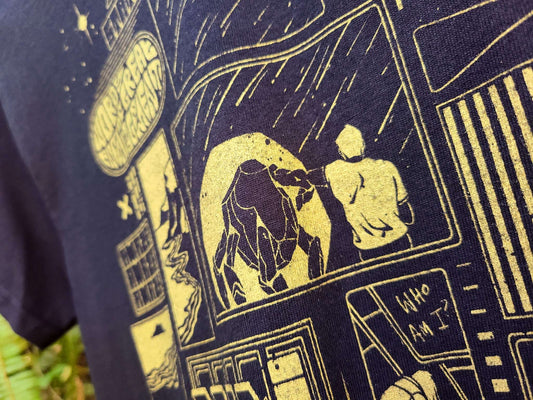 Close-up of a black t-shirt with gold screen printed ink featuring a comic-style image of Grace and Rocky from Project Hail Mary. 