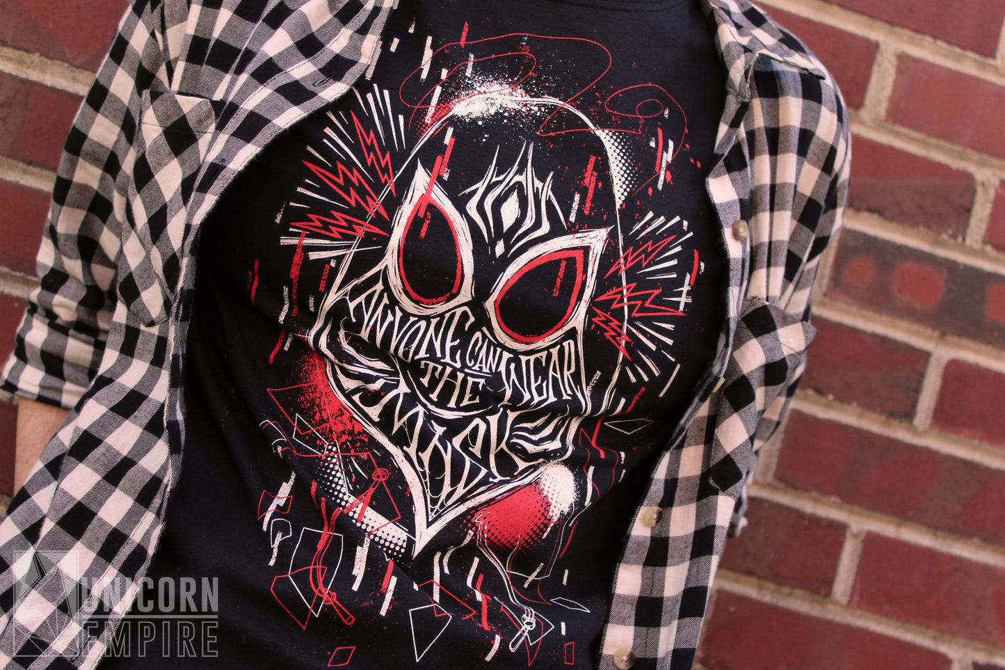 Anyone Can Wear the Mask t-shirt, close-up of red and white screen print detail
